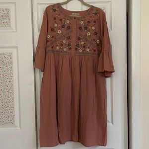 Embroidered knee length dress.